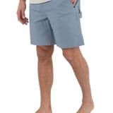 Person wearing light blue shorts on a white background