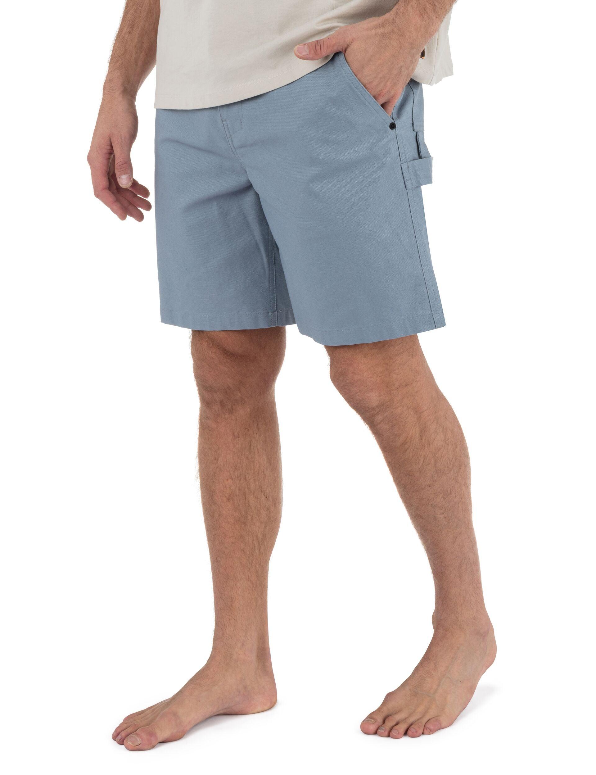 Person wearing light blue shorts on a white background