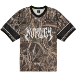 Camouflage-patterned t-shirt with a brand logo on a white background