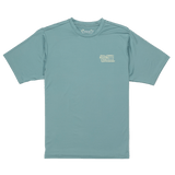 Teal t-shirt with a small logo on a white background